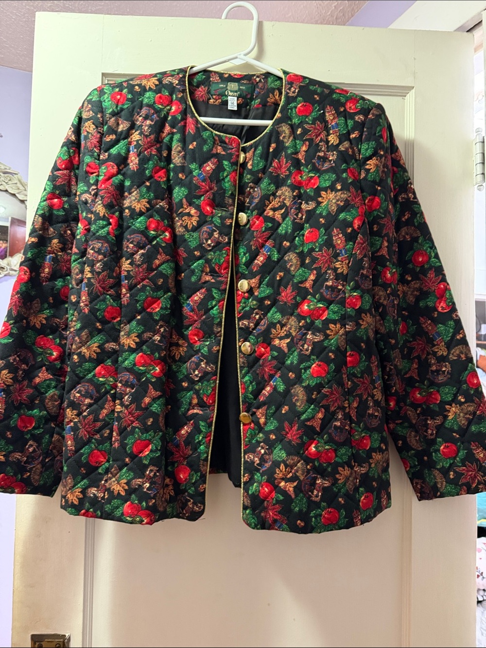 Orvis size 14 quilted woman’s black, red, and gold jacket.
